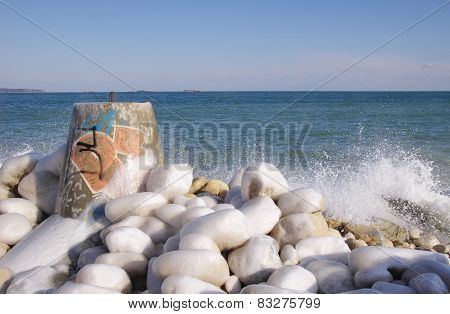 Frozen Tetrapod  And Stones In Winter Day