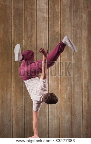 Cool break dancer against wooden planks background