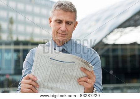 Closeup Of A Stockbroker Reading Stock Price