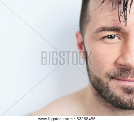A sexy portrait of a man over a gray background