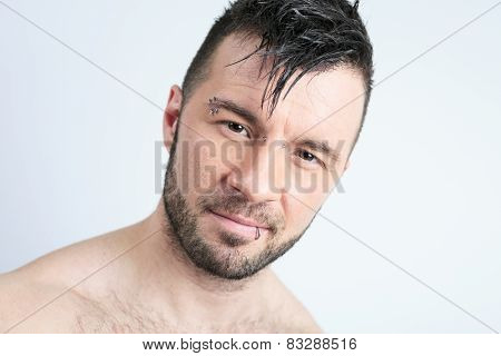 A sexy portrait of a man over a gray background