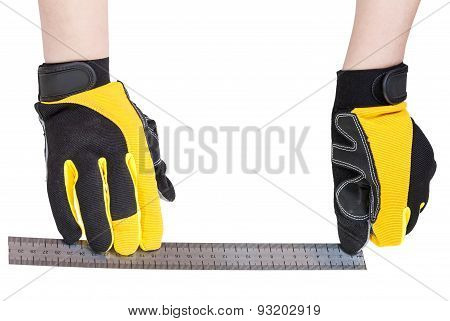 Worker Hands In Protective Glowes With Ruller
