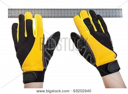 Builder Hands In Safety Glowes With Ruller