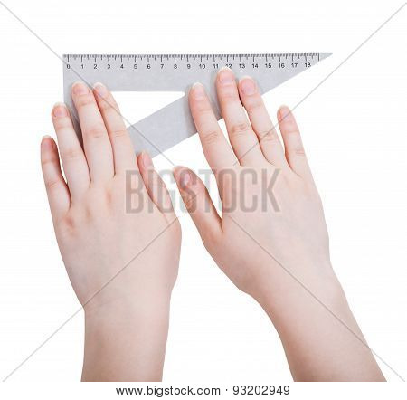 Female Hands With Metallic Triangle Ruller