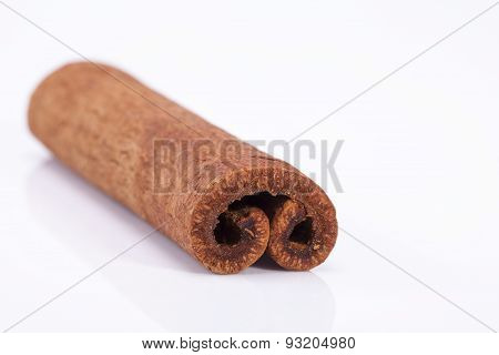 Single Dried Cinnamon Stics On White Background