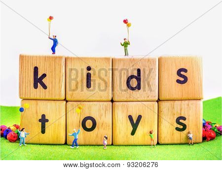Image Of Mini Figure Kids Dolls Hold Balloon Playing On Toys Wooden  Blocks .
