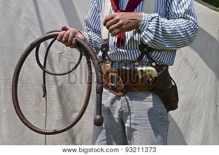 Cowboy with bull whip in hand