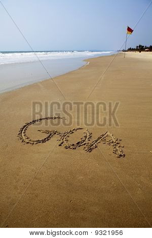 Goa escrito en la arena.