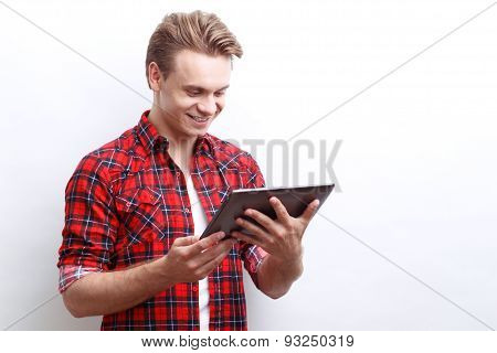 Pleasant guy surfing through the Internet