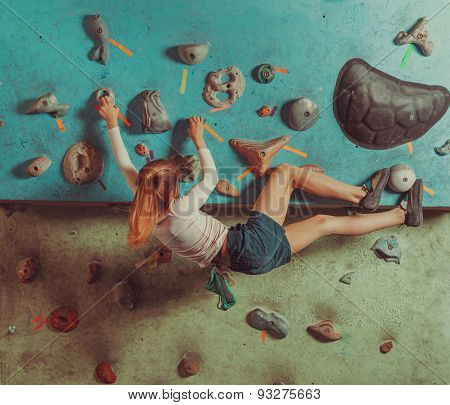 Little Girl Training In Climbing Gym