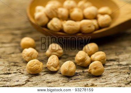 Scattered Chickpeas From A Jute Bag With A Spoon On Old Wooden Background