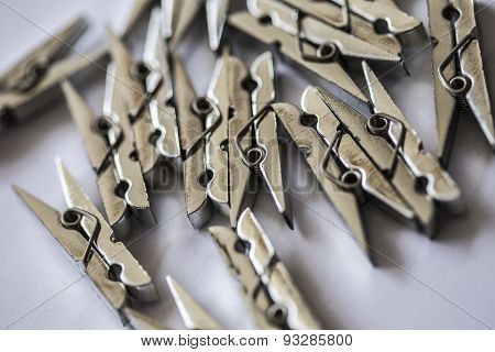 silver clothespin on white background