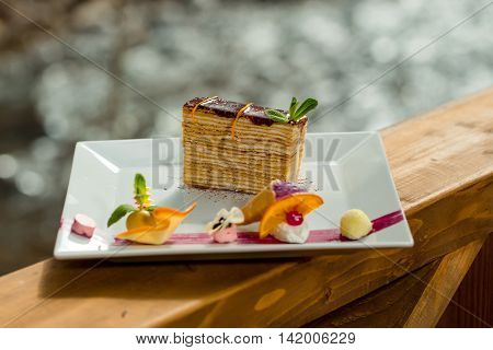 Sweet food calorie. Dessert - Cake with chocoltae Icing and Fresh Mint.