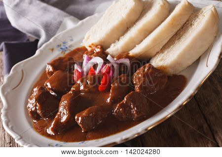 Thick Goulash With Dumplings On A Plate Close-up. Horizontal