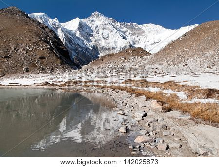 view of Cho Oyu mirroring in lake - Cho Oyu base camp - Everest trek - Nepal