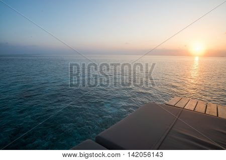 Sunrise with sea view sun bed Maldives
