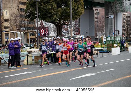 NAGOYA JAPAN - MARCH 13, 2016: Nagoya Women's Marathon 2016. Women's running in the downtown. Course Start and finish at Nagoya Dome Distance 42.195km. Nagoya city Japan.