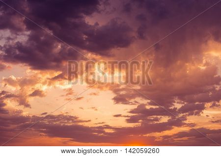 sunset sky an clouds with dramatic light. colorful sky background.