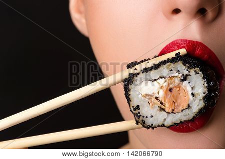 sexy female mouth with roll close up