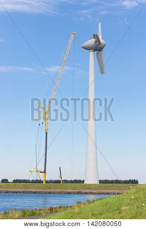 Construction site new Dutch windturbine with large crane
