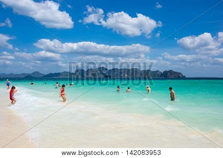 CRABI PROVINCE THAILAND - FEBRUARY 02 2015: Tourists swimming in turquoise water of Andaman sea at Krabi province Thailand
