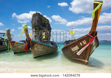 CRABI PROVINCE THAILAND - FEBRUARY 02 2015: Traditional thai long tail boats waiting for tourists to travel to beautiful islands in Thailand