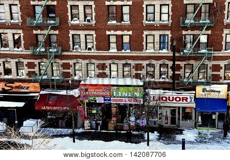 New York City -Janury 24 2016: Snow covers sidewalks and store awnings along upper Broadway in Harlem following a January weekend storm