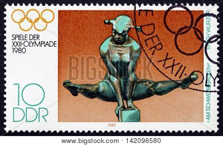 GERMANY - CIRCA 1980: a stamp printed in Germany shows On the Bars by Erich Wurzer 22nd Summer Olympic Games Moscow circa 1980