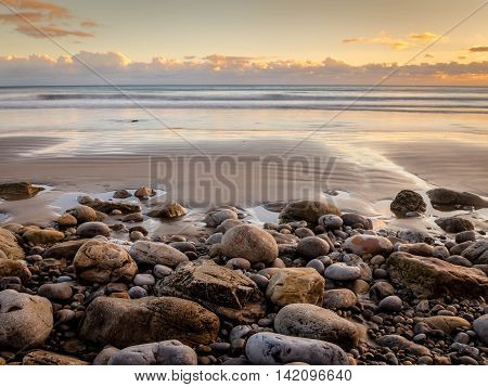 Pebbles at Sunset on the Shore.
Pendine, Carmarthenshire, Wales.