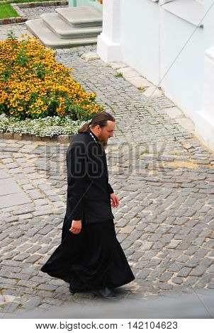 SERGIEV POSAD, RUSSIA - SEPTEMBER 06, 2012: Priest in Trinity Sergius Lavra Sergiev Posad Russia. UNESCO World Heritage Site.