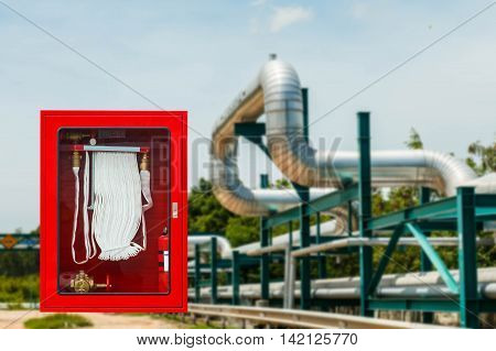 Fire safety equipment cabinet line industrial background.