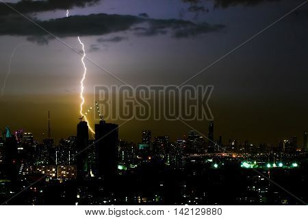 Dramatic thunder storm lightning bolt on the horizontal sky and city scape
