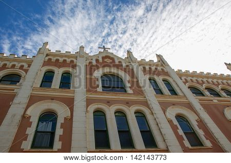NEW NORCIA,WA,AUSTRALIA-JULY 15,2016: Upward perspective of the brick Spanish gothic St. Ildephonsus College for Boys in the historic monastic town of New Norcia, Western Australia.