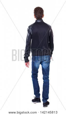 Back view of going  handsome man. walking young guy . Rear view people collection.  backside view of person.  Isolated over white background. Curly guy in a black leather jacket goes away.