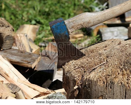 Ax Of The Woodcutter On The Block Of Wood In The Woodshed