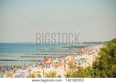 Mielno Poland - June 24 2016: Crowds of sunbathers on the beach in Mielno.