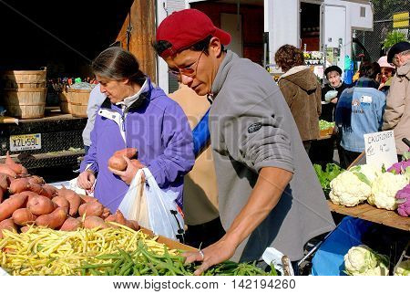 New York City - November 5 2006: People shopping at the popular West 77th Street Sunday outdoor farmer's market on the Upper West Side of Manhattan