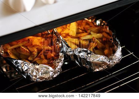 Rusic style potato baked with butter and herbs in foil