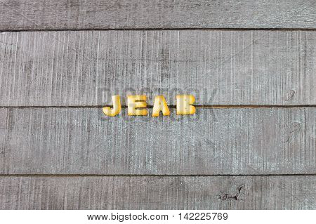 alphabet biscuit on wooden table stock photo