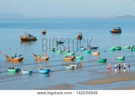 MUI NE, VIETNAM - DECEMBER 25, 2015: Early morning in the Fishing harbor village of Muy Ne.Tourist landmark of the  Vietnam