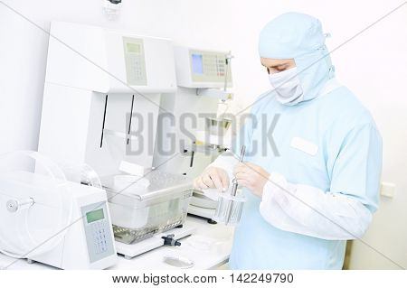 Pharmaceutical researcher working with disintegration tester