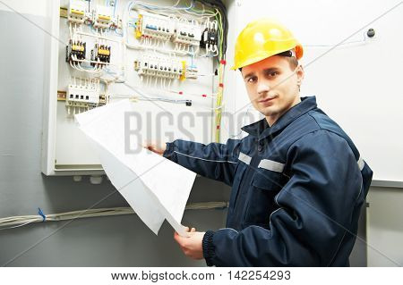 electrician engineer worker with blueprint project