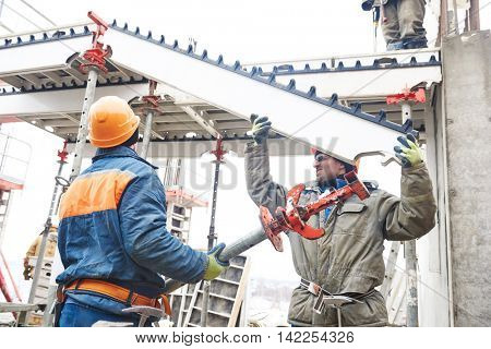 worker installing falsework construction