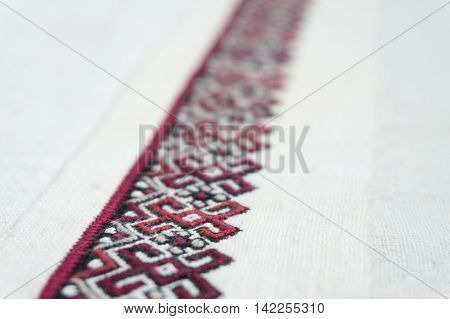 fragment of embroidery on the homespun cloth
