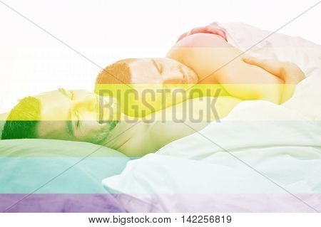 A homosexual couple onder a bed in studio white on studio.