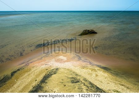 Old snag, polished by the waves of lake Baikal, lies at the mouth of the river Kika. From a distance it is very similar to the head of a crocodile.