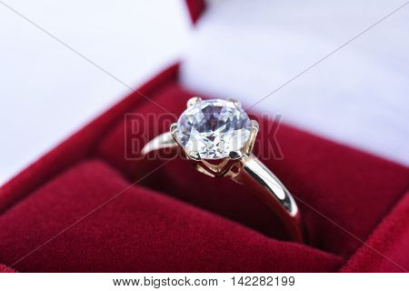 Wedding ring in a red gift box