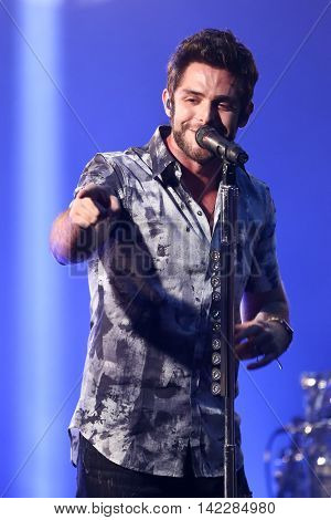 NEW YORK-SEPT 28: Country music artist Thomas Rhett performs at the iHeartRadio Album Release Party with Thomas Rhett on September 28, 2015 at the iHeartRadio Theater in New York City.