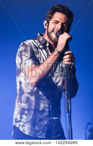 NEW YORK-SEPT 28: Country music artist Thomas Rhett performs at the iHeartRadio Album Release Party with Thomas Rhett on September 28, 2015 at the iHeartRadio Theater in New York City.