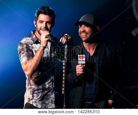 NEW YORK-SEPT 28: Singer Thomas Rhett (L) and radio host Cody Alan at the iHeartRadio Album Release Party with Thomas Rhett on September 28, 2015 at the iHeartRadio Theater in New York City.